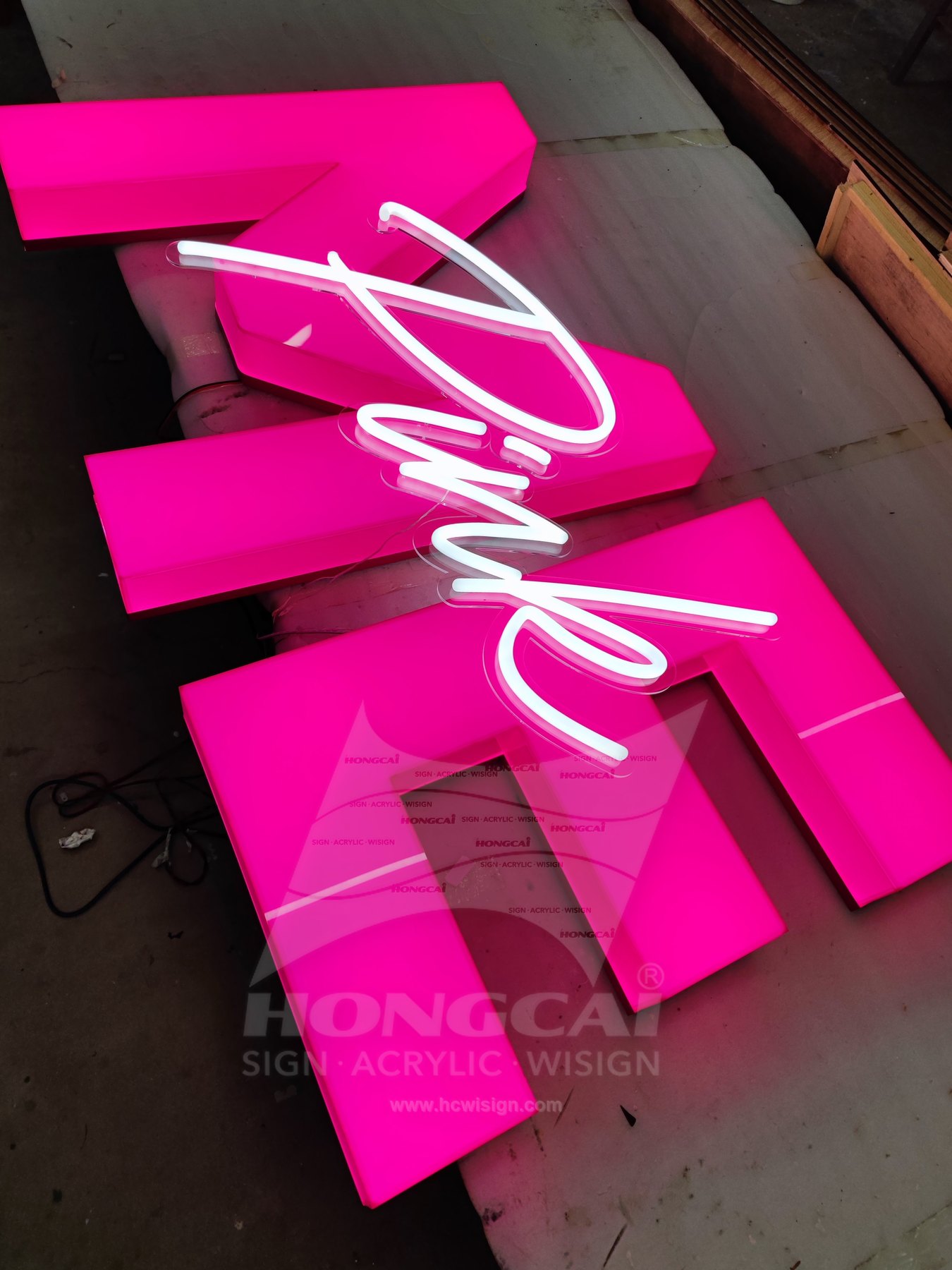 Pink Me Full-Body Acrylic Letters with CNC Script — Pink Me full-body acrylic combination illuminated on the factory workbench